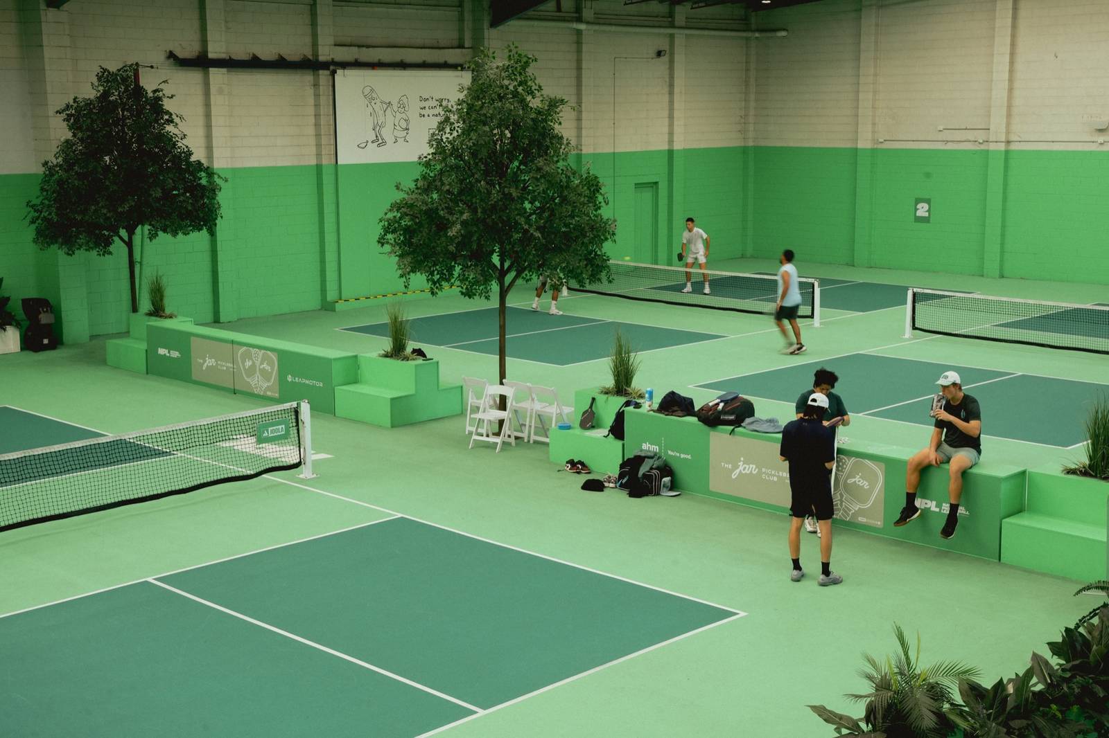 Courts, trees and green planter boxes inside The Jar South Melbourne