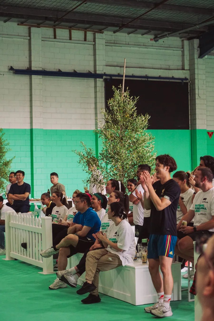 Spectators cheering from the courtside grandstand at The Jar South Melbourne