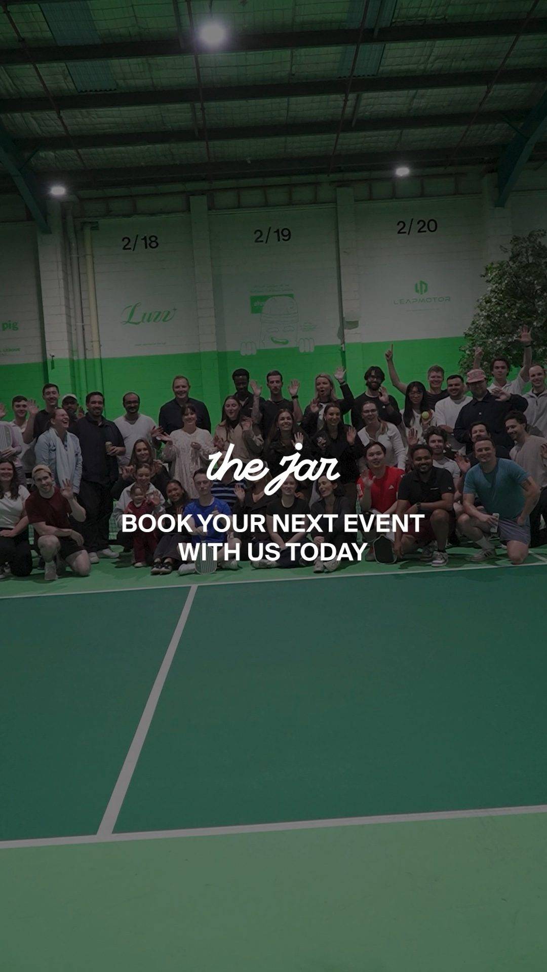A group playing pickleball together at The Jar
